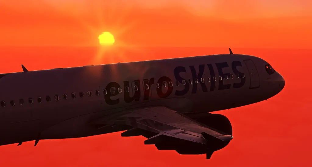 Nahaufnahme eines Flugzeugs der virtuellen Airline euroSKIES Fenix A320, aufgenommen von der Flügelspitze aus, mit einem Sonnenuntergang im Hintergrund.